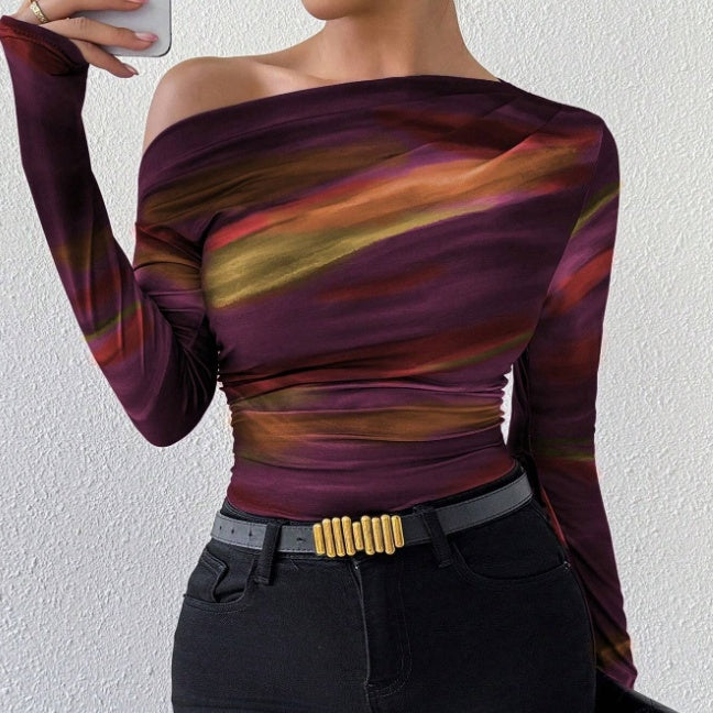 Trendy graphic print tee for women with long sleeves and a relaxed fit—perfect for layering, casual streetwear, or stylish everyday fashion looks.